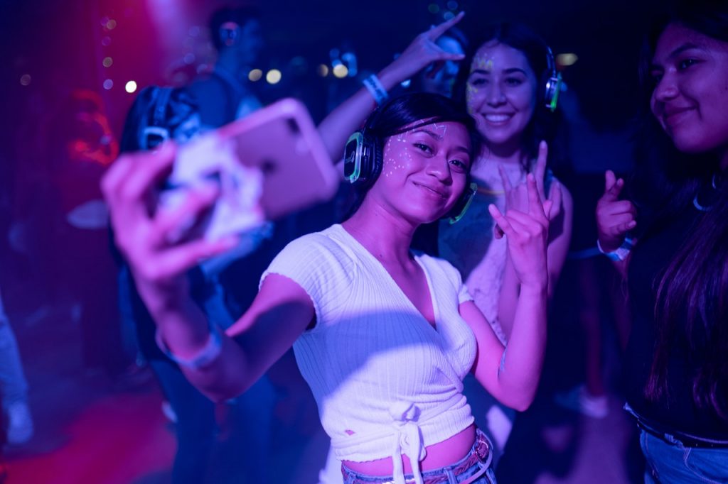 women taking a photo in a party